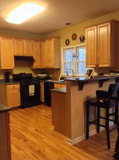 No Granite But Step Up For Bar Dwell Pinterest Kelly And Sunjay Are Looking Forward To More Counter E Without Te Bar Darker Cabinets Restained Jupurano Santa Cecelia Granite