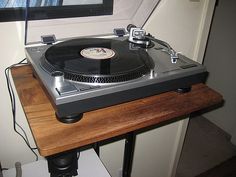 Seriously nice vinyl record stand with a shelf for the