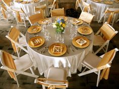 Reception Room At The Thursday Club White Resin Chairs Ivory White And Gold Wedding Satin Linen Charger Plates Sashes On Resin Chairs With A Padded Seat