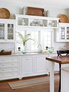 country kitchen decorating ideas items of same colortexture over the cabinets create stremlined look that still has interest white cottage farmhouse kitchens country kitchen designs we love country kitchen decorating ideas items of same colortexture over the cabinets create stremlined look that still has interest white cottage farmhouse kitchens country kitchen designs we love