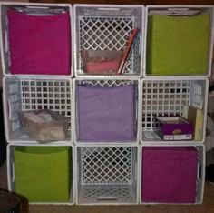 DIY fabric bin storage. Just use milk crates (not the ones you buy at wal mart but the actual 4 gallon milk crates). Tie together with zip ties and if you wish you can spray paint or wrap in fabric for decoration. The fabric bins fit perfectly in them.