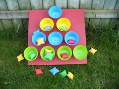 Basically We Just Bought A Small Piece Of Plywood And Board Made Legs Nailed Them On Painted It Red Then Screwed Colourful Bowls Basically We Just Bought A Small Piece Of Plywood And Board Made Legs Nailed Them On Painted It Red Then Screwed Colourful Bowls