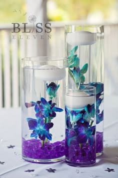 Elegant Cobalt Blue Kauai Island Wedding Purple And A Centerpiece Collection Of Amazing Underwater Blue Dendrobium Orchids Accented By Pure White Floating Candles And Purple Gems Breathtaking