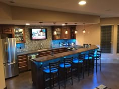 DIY basement bar fitted with concrete countertops. Garages, Basement Bar Plans, Diy Basement Bar, Man Cave Home Bar, Basement Bar Designs, Rustic Basement Bar, Small Basement Remodel, Basement Remodeling, Basement Renovations