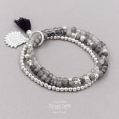 Pulsera /"Abril/" charm karma en plata tibetana con hilo rojo
