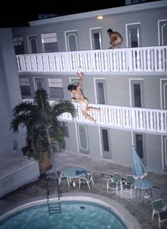 Nic and jacob bare poolside