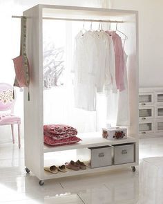 Portable closet - could make something like this pretty simple out of hollow core doors - need a closet for this room....