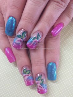Pink and blue glitter and one stroke flower nail art Taken at:7/5/2014 1:25:41 PM Uploaded at:7/5/2014 7:53:48 PM Technician:Elaine Moore