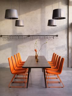 80 Best Orange Dining Room Images Arquitetura Meeting Chair In Pure Solid Orange Colour Against Dark Wood And Pale Grey Room Surfaces