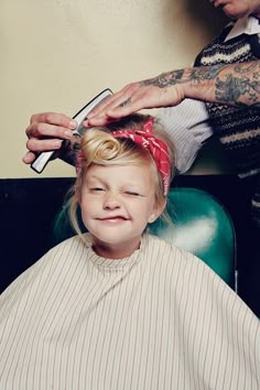 How cute is this little Rosie the Riveter hair-do?!