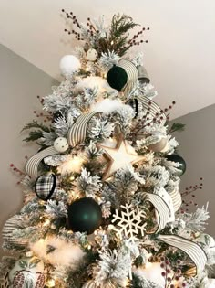 modern farmhouse christmas tree with hunter green, black, white and silver. hygge and hearth & hand inspired. Winter, Black Christmas Tree Decorations, Green Christmas Tree Decorations, White Christmas Trees, Black Christmas Trees, Flocked Christmas Trees, Flocked Christmas Trees Decorated