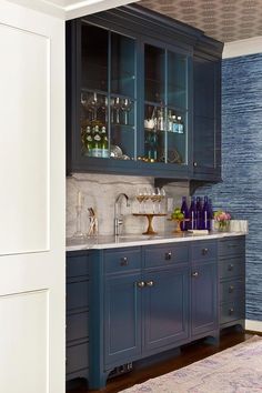 16 Best Wet Bar Cabinets Images Blue Wet Bar Boasts Gl Front Cabinet Suspended Over Lower Cabinets Adorned With Br