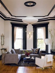 This living room contrasts space and time by applying today's contemporary design and colors to a 110 year old Victorian home. Interiors, Black Window Trims, Black Trim, Victorian Living Room, Light Walls