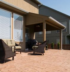 Covered Patios And Decks Slanted Roof Evergrain Deck Stamped Stained And Sealed Concrete Patio With New Slanted Roof Over It In Olathe