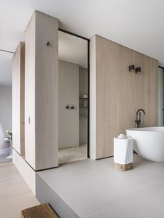 Powder room/laundry: tinted mirror wall panels, polished concrete ... Powder room/laundry: tinted mirror wall panels, polished concrete ...