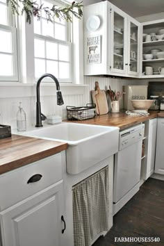 Butcher block and white cabinets is nice. Don't care for the curtain under the sink, and would still prefer some kind of tile backsplash over wood. Farmhouse Kitchen Cabinets, Farmhouse Sink Kitchen, Farmhouse Kitchen Backsplash Ideas, Modern Farmhouse Kitchens, Kitchen Redo