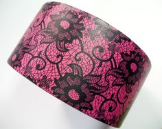 hand made duct tape wallet with colored lace deisgn on it