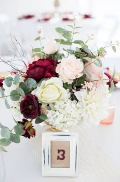 Turning A Favorite Getaway Spot Into Gorgeous Destination Wedding Burgundy Wedding Flowers And A Pop Of Shades Pink For Beautiful Table Centerpiece