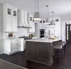 White And Brown Kitchen Features Shaker Cabinets Paired With Collaborative Design Project Between Marianne Jones Interior Designer From Llc And Sandra Daubenmeyer Ksi