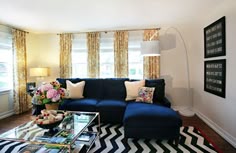 Yellow and blue living room features blue coral prints in bamboo ... Yellow and blue living room features blue coral prints in bamboo ...