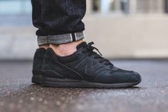 black new balance 574 on feet black new balance 574 on feet