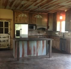 Rustic kitchen with old door for pantry door, custom made island, tin ceiling. Home, Kitchen Ideas, Kitchens, New Kitchen, Kitchen Remodel, Farmhouse Kitchen Cabinets, Kitchen Decor, Farmhouse Kitchen Decor, Rustic Kitchen Cabinets