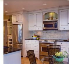 Microwave Above Stove With Raised Cabinet For The Home Pachena Place Mediterranean Kitchen Vancouver The Sky Is Limit Design Like Lit Shelf Over Microwave