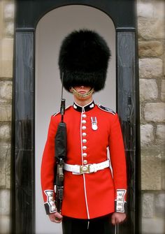 welsh guardsman wearing his summer guard order red tunic in 2018
