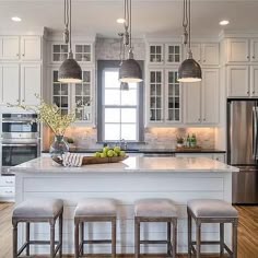 47 Best White Kitchen Ideas Decor Images On Pinterest In 2018 Four Backless Gray French Bar Stools Sit In Front Of A White Shiplap Island Topped With Marble Countertop Illuminated By Three Pendants