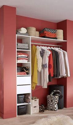 the closet is organized with clothes and bags