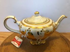 Authentic Japanese Decorative Earthenware Tea Pot 18 Fl oz with Stainless Steel Strainer Afternoon Tea Teapot Textured Glaze Floral Design Handcrafted in Japan Fuji Merchandise Corp Cherry Blossoms Pot