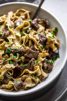 This Instant Pot Beef Stroganoff recipe results in the most tender beef, in a saucy, creamy gravy. The egg noodles even cook in your pressure cooker. #beeffoodrecipes