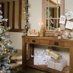 dress up a hallway console table with homespun wooden decorations and use birch candles to add - Christmas Hallway Decorating Ideas dress up a hallway console table with homespun wooden decorations and use birch candles to add - Christmas Hallway Decorating Ideas