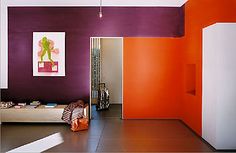 Mid Century Living Room With Orange Walls The World Is Bold Purple And Orange Walls