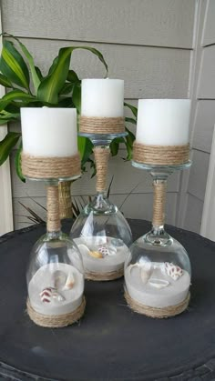 This is a set of 3 Wine glasses turned into Candle holders. Inside Wine glasses are colored sand and real seashells. The color blue in pictures I am having trouble getting but I have other color options. See pictures. I have light blue, dark blue, medium blue, coral, natural color, Home Crafts, Seashell Crafts, Dekoration, Shells And Sand, Deco, Beach Crafts, Diy Decoração