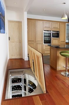 trapdoor in the kitchen floor: spiral wine cellars | trap door trapdoor in the kitchen floor: spiral wine cellars | trap door