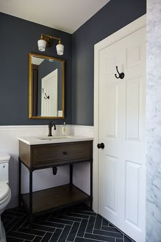 Modern Mountain Home Tour Master Wing Bath Inspirations Blue And Gray Kid S Bathroom Features Upper Walls Painted Dark Lower Clad In White Subway Tiles Lined With A Wood Iron Washstand