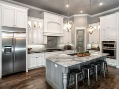 Classic L Shaped Kitchen Remodel With White Cabinet And Gray Island Marble Countertop Amazing Ideas of Kitchen Remodels with White Cabinets kitchen remodeling. white corner cabinet. galley kitchen remodel. Source by courtcurry Kitchen Cabinetry