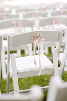 Simple Way To Dress Up Our Basic White Folding Chairs For Al Delicate Baby S Breath Ceremony Decor Tied To White Folding Chairs With A Pink Ribbon