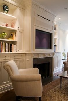 Placing a TV Over Your Fireplace - A Do or a Don Living rooms and Traditional living rooms