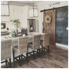 neutral tones textures sliding kitchen barnyard door straw high back stools light fixtures that are modern yet country grey wooden floors - Modern Farmhouse Kitchen neutral tones textures sliding kitchen barnyard door straw high back stools light fixtures that are modern yet country grey wooden floors - Modern Farmhouse Kitchen