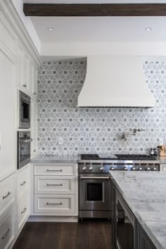 Top 15 Patchwork Tile Backsplash Designs For Kitchen Amazing Dana Benson Construction Ivory And Gray Kitchen Features Shaker Cabinets Paired With Marble Countertops A Flower Mosaic Tiled Backsplash