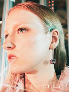 Inside the celebration of the Gucci Gift campaign, a close up of the new silver earrings featuring a cube pendant enriched with an intricately detailed pattern and the Square G—an archival design from the 70s.