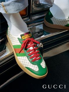 Low tops from the new Gucci-Dapper Dan collection feature the Web stripe and the yellow logo.