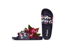 Women's black flip-flops with contrasting white print and colorful studs.A pair of sandal you won´t want to remove. Find it on Desigual.com