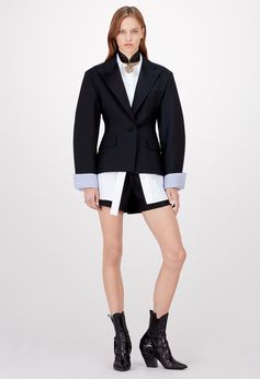 Louis Vuitton Cruise 2018 - Look 4 This look pairs a flattering waisted jacket with the collection's emblematic poplin shirt to create one of its statement silhouettes. Shorts in shiny silk wool radzimir provide a shiny/matte contrast: another key signature this season.