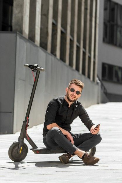Young Beard Man On Electric Scooter With Smartphone In Hand Bearded Men Young Man