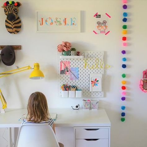 girls room with ikea desk and lamp zebra head wall hanging rainbow pompoms and peg board kate s desk for girls room kid room decor ikea pegboard ideas kids