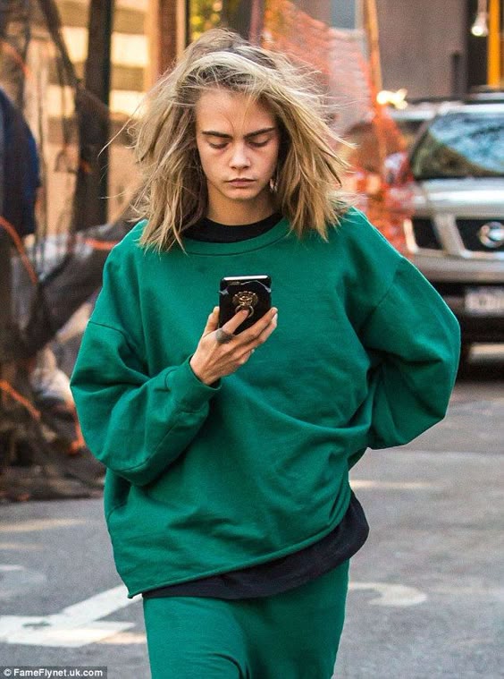 Make-up free Cara Delevingne rocks unkempt bedhead tresses