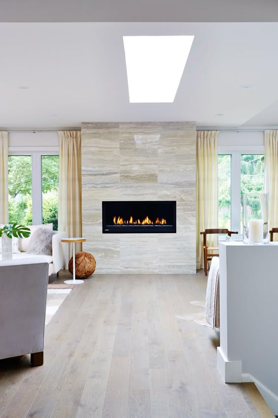 As seen on season 1 of Sarah Sees Potential, designer Sarah Richardson replaced an old, ugly fireplace with a chic, contemporary model and custom limestone tile surround.